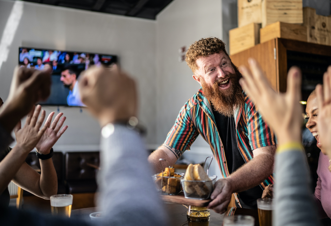 People are entertained at restaurant by television