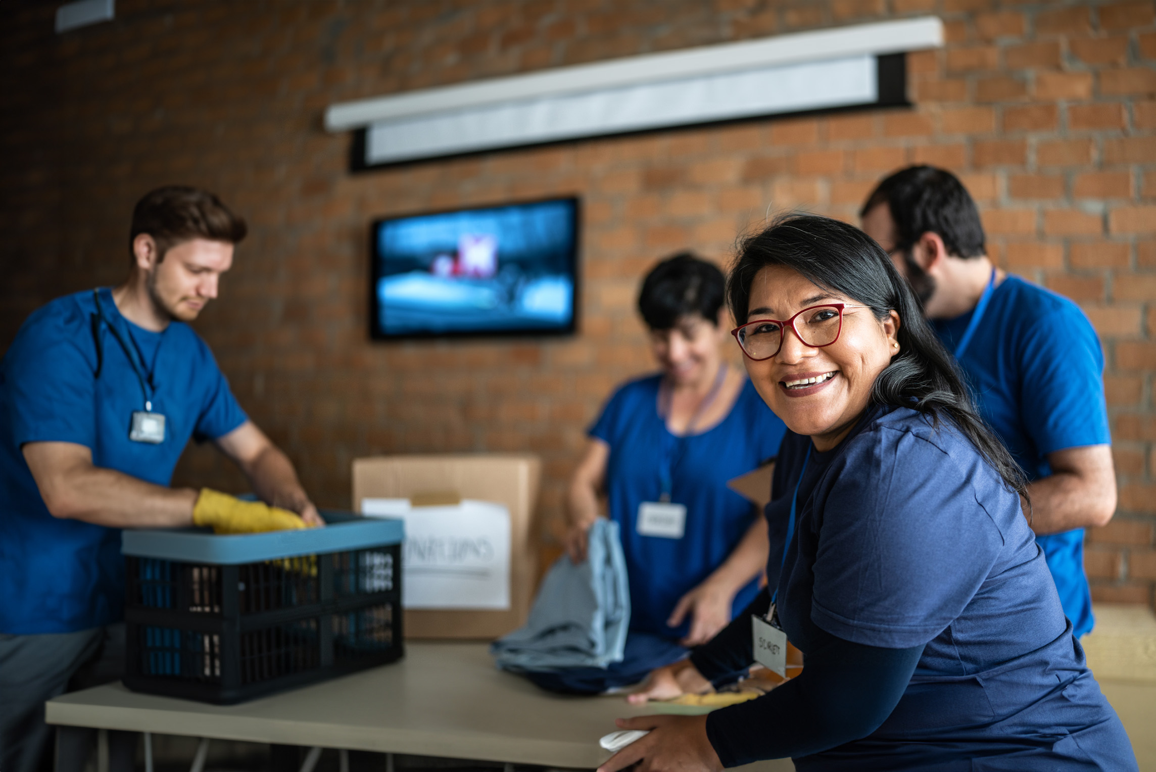 Nonprofit organization with tv entertaining staff in the background.