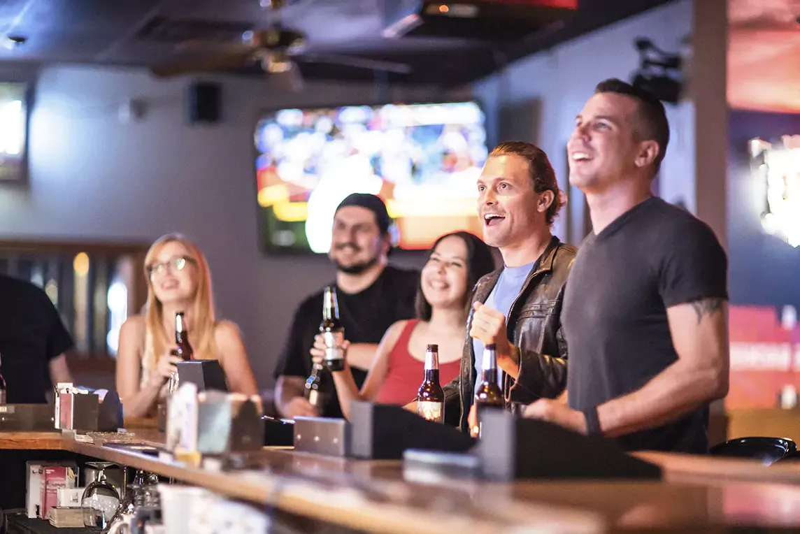 DIRECTV FOR BUSINESS - Friends at bar watching baseball